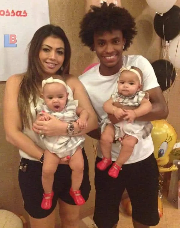 Willian and Vanessa Martins pose with their twin.
