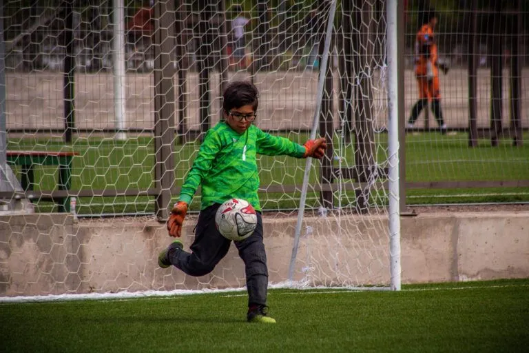 Illustrative stock photo: child playing soccer