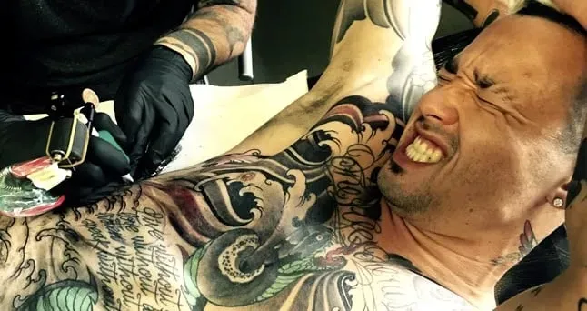 Belgian-Indonesian Football Star Radja Nainggolan, in the process of making his tattoos.