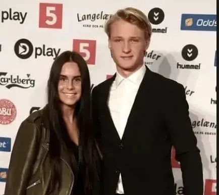 Cecilie Hornbaek and her lover, Kasper takes a photo at an event.