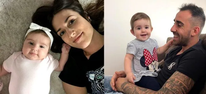Beatriz Lopez and Paco Alcacer, together with their child.