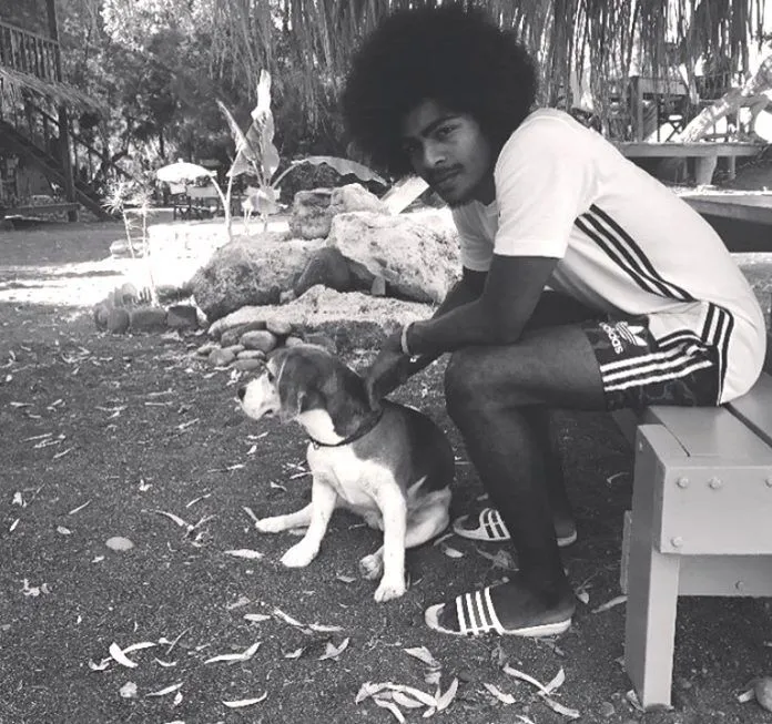 Hamza Choudhury poses with his Dog.