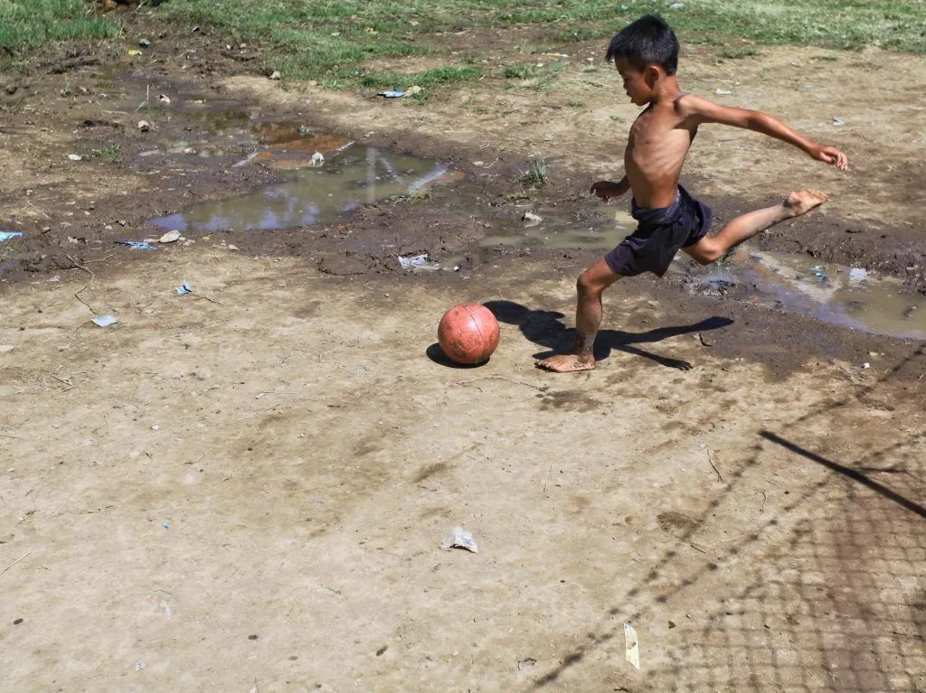 Illustrative stock photo: child playing soccer