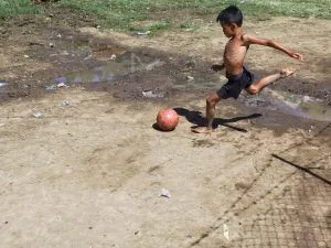 Illustrative stock photo: child playing soccer