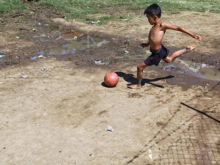 Illustrative stock photo: child playing soccer