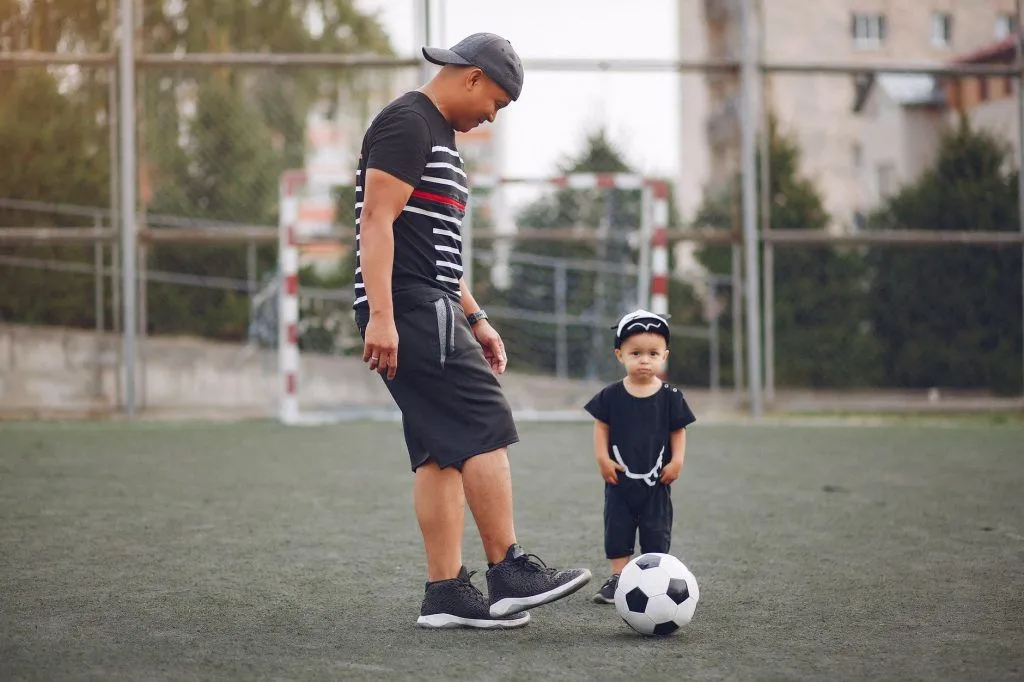 Illustrative stock photo: parent child soccer