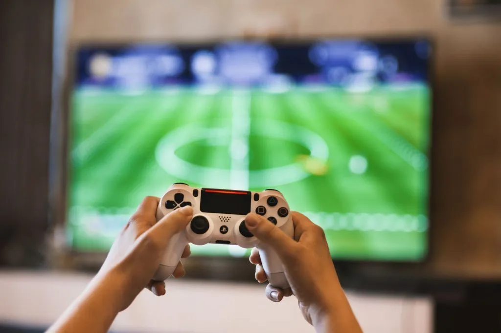 Illustrative stock photo: football video game controller