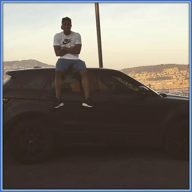 Is Lasso the person sitting on top of the car?
