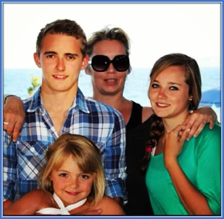 Young Timothy Castagne holding his youngest sister Emmi. The Belgian is alongside his Mum and Noemie (his immediate younger sister).
