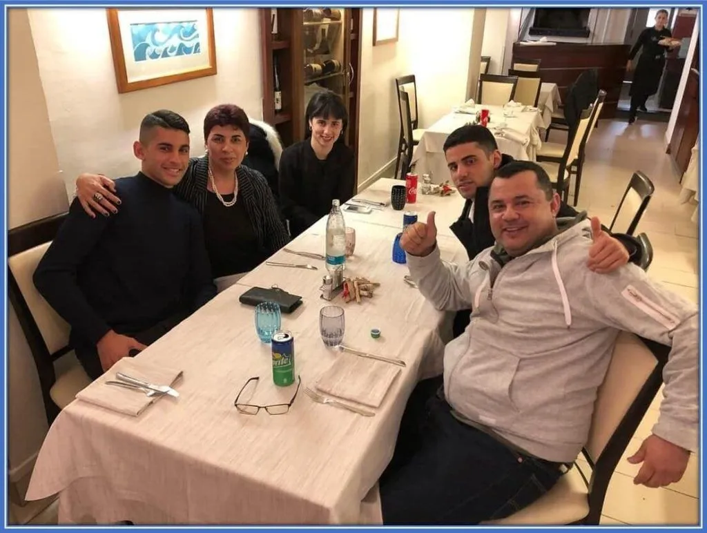 A rare image that captures his parents, brother, and sister in one sitting. They are truly a united family.