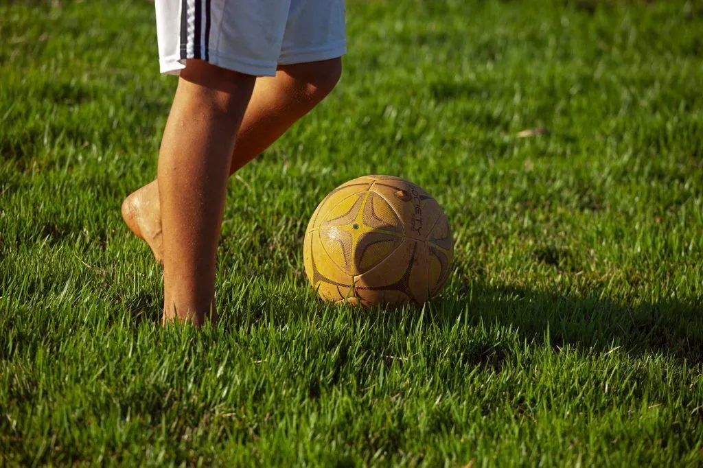 Illustrative stock photo: child playing soccer
