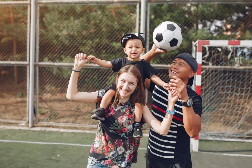 Illustrative stock photo: parent child soccer