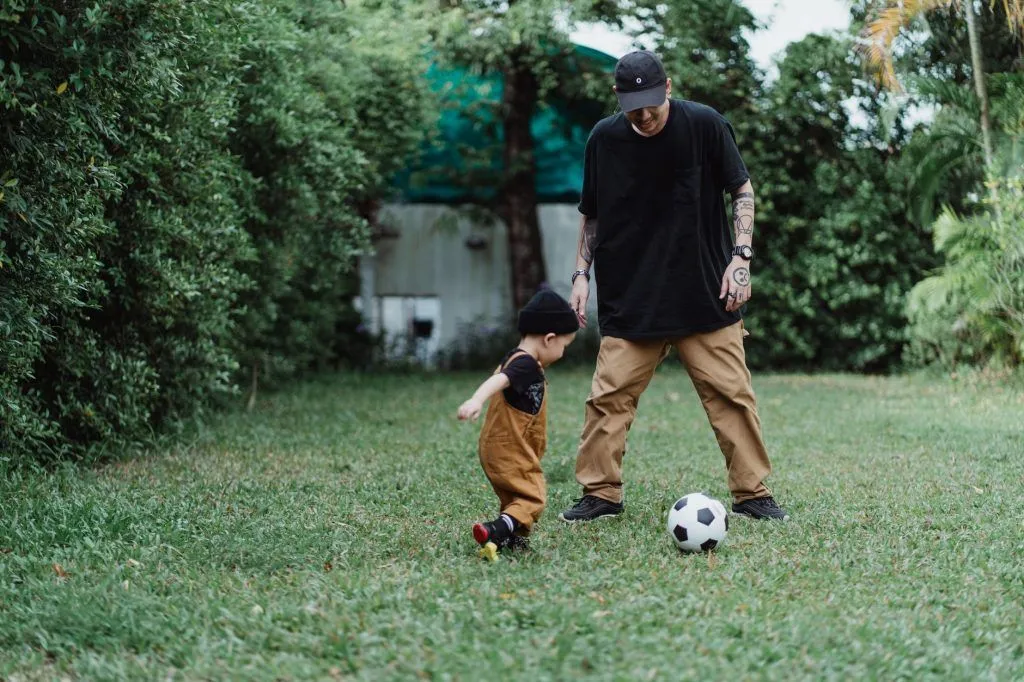Illustrative stock photo: parent child soccer
