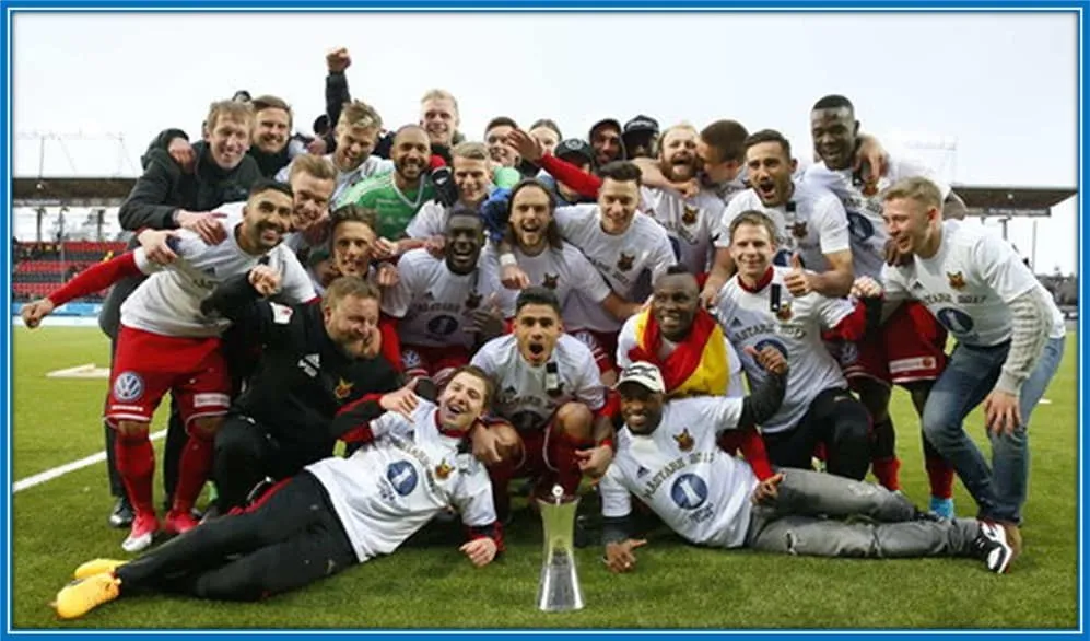 Graham Potter celebrates with &Ouml;stersund players as he helped them win a trophy.