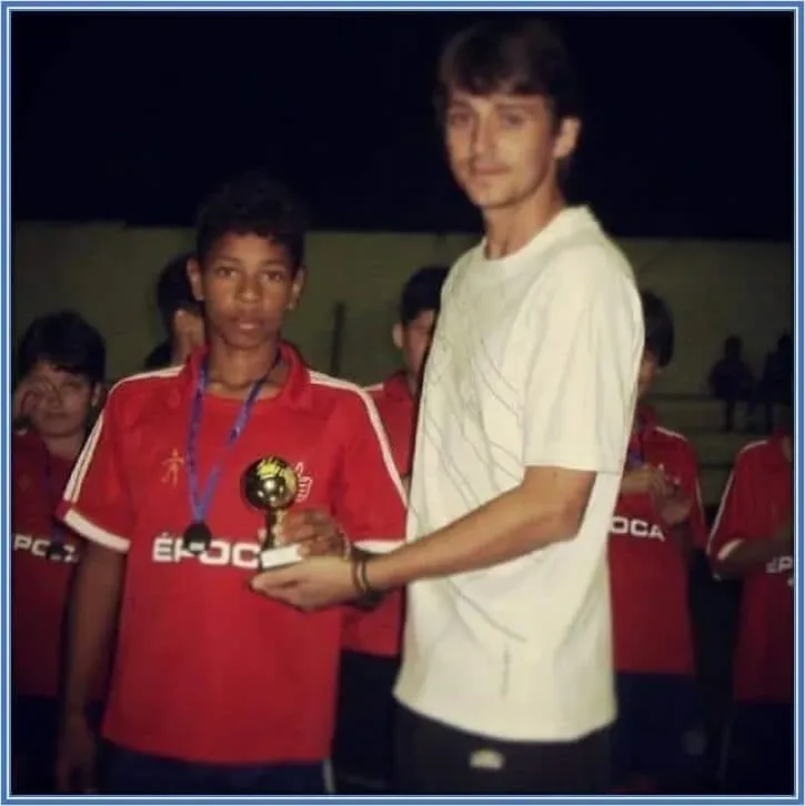 He grew up winning many trophies in soccer.