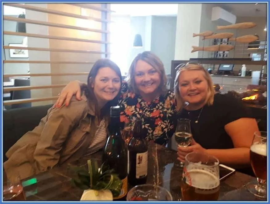 Donna, alongside persons whom she calls family.