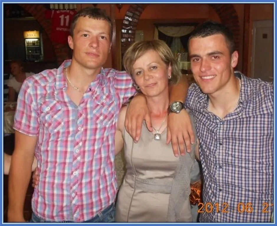 We picture Filip Kostic's Mum here, standing in between him and his brother, Stefan Kostic.