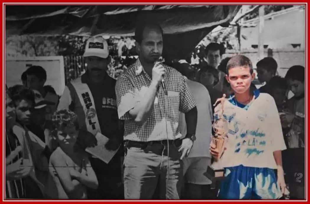 Pepe is receiving a trophy for his performance on the Field.