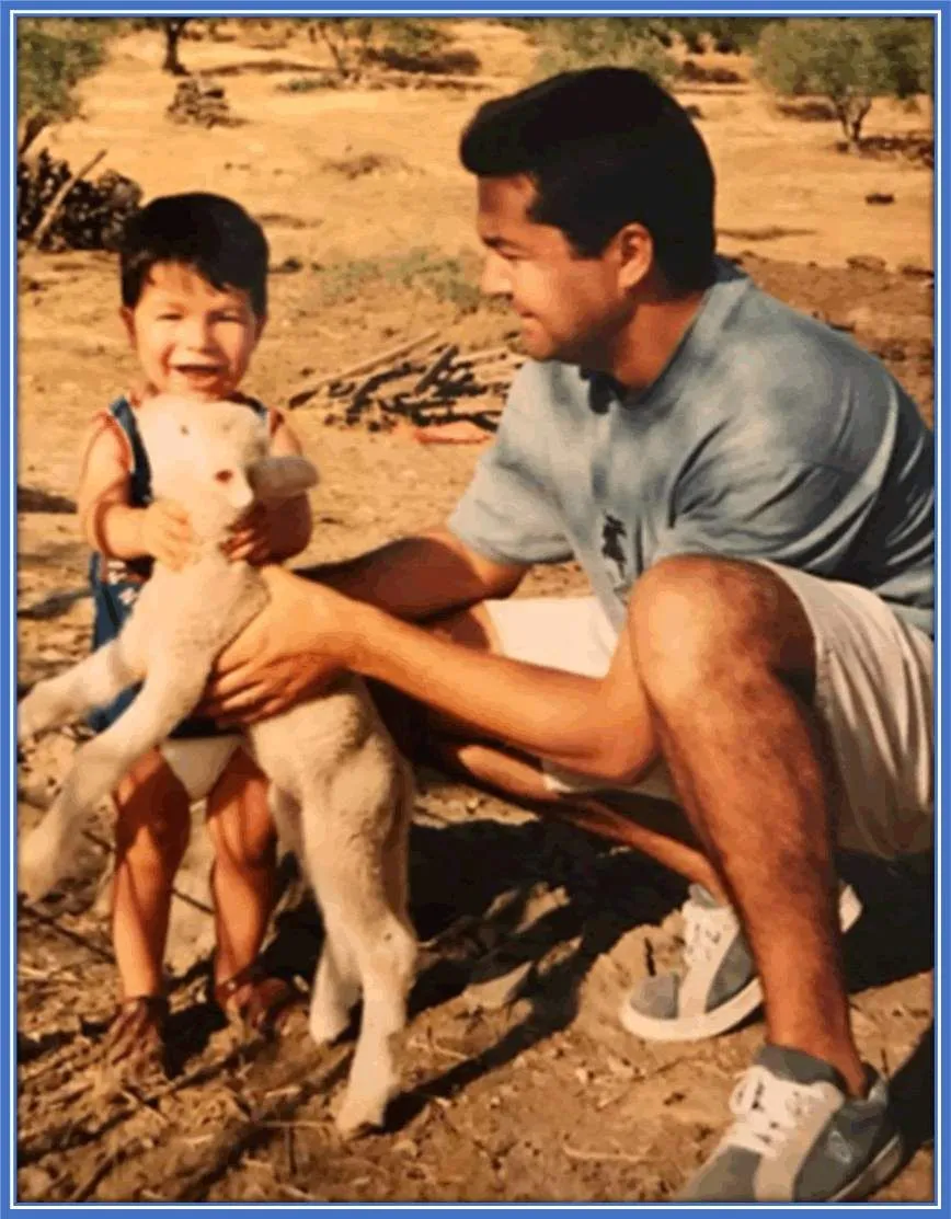 An earliest picture of Carlos Soler with his dad and their pet.