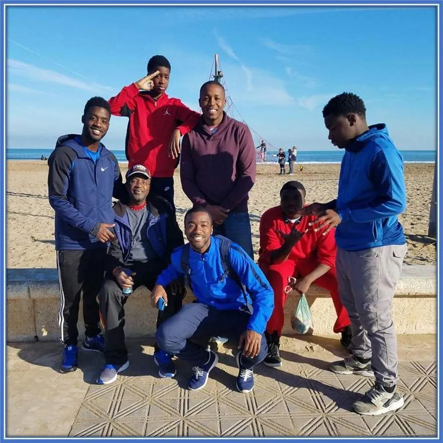 A photo of Shaq Moore's Brothers, alongside their Dad.