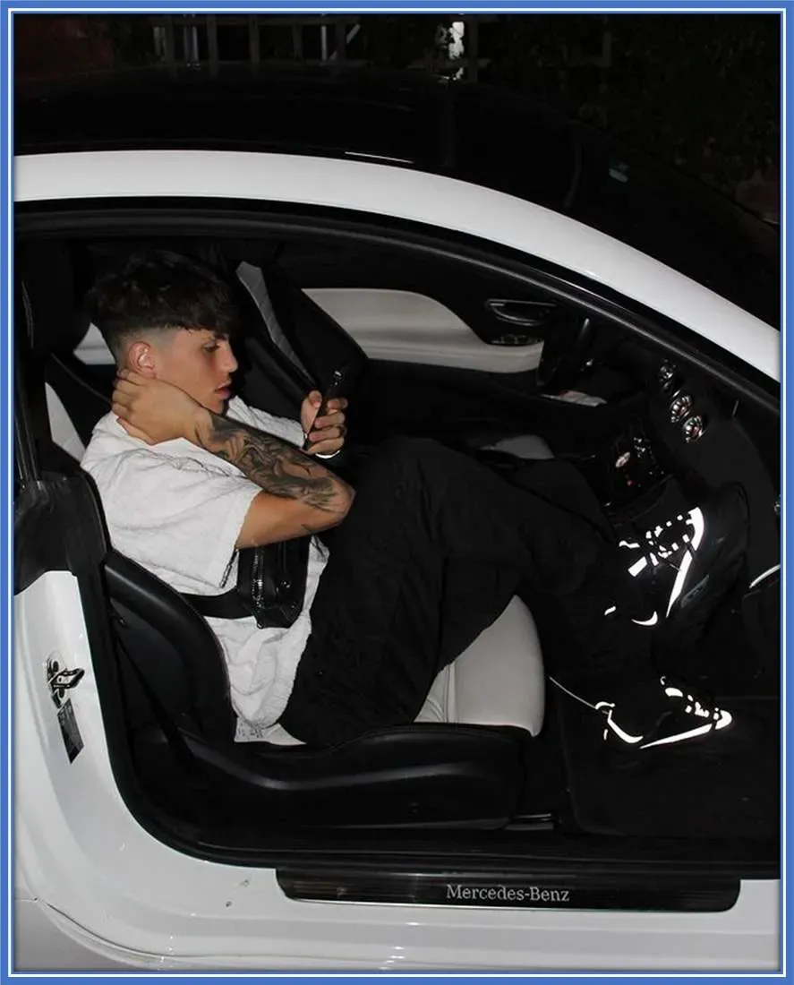 The Red Devil Athlete enjoys coordinating his clothing with his car to express his personal style.