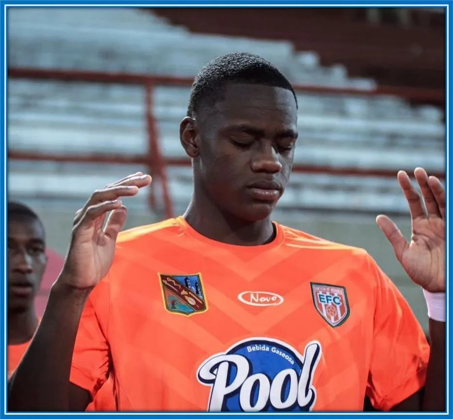 Duran is pictured saying his prayers before a Envigado football match.
