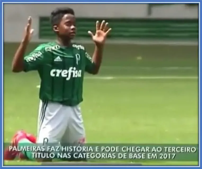 "Endrick in a moment of devotion: Amidst the excitement of a football match, Endrick takes a moment to pray, reflecting the strong Christian values instilled in him by his parents.