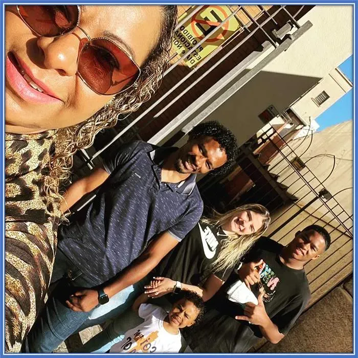 Endrick Felipe's supportive parents are captured in this heartwarming photo as we see them embracing their son's girlfriend, Lara Hernandes, and accepting her as part of the family.