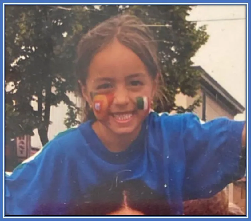 A younger version of Julia Grosso. Looking at her, it is evident that her childhood was filled with happiness and laughter.