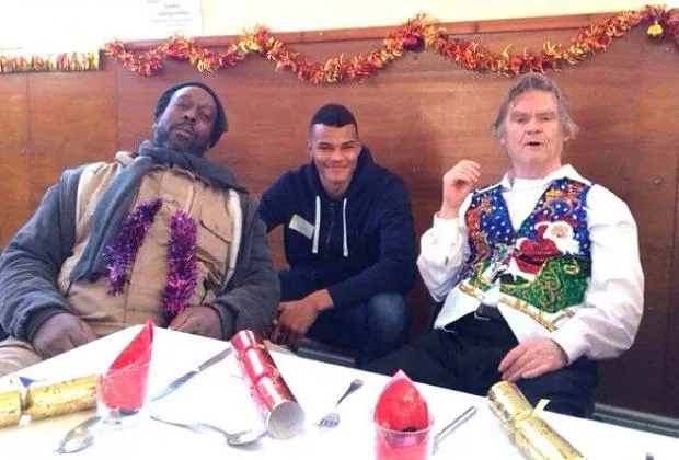 Tyrone Mings returns back the favour by visiting & helping people living at the homeless shelter. Credit: Ipswich star