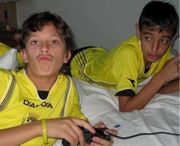 Bruno Fernandes (right) playing a video game with his friend before a training session at Boavista FC.