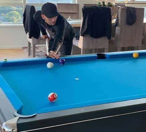 Playing pool is one of his hobbies.