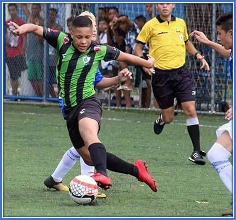 A dribbling maestro (Roque) is pictured effortlessly manoeuvring the ball past an opponent.