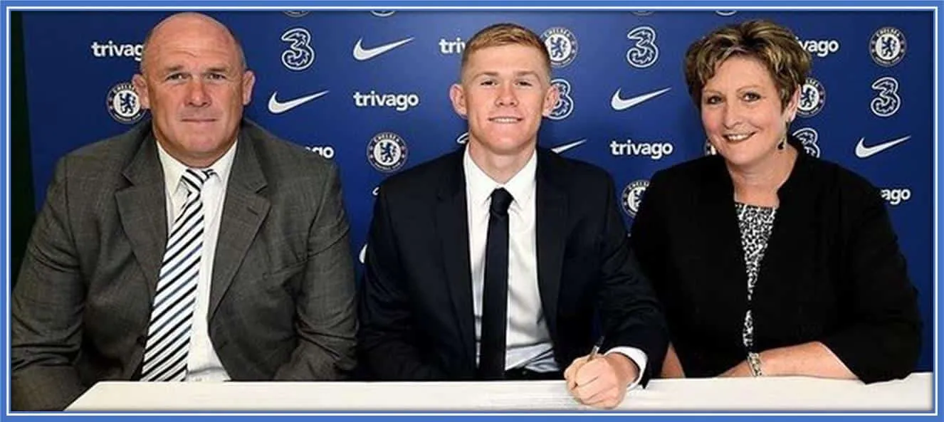 Lewis Hall's Parents took this photo with him when he signed his first professional contract with Chelsea FC.