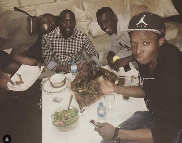 Idrissa Gueye with unidentified members of his family.