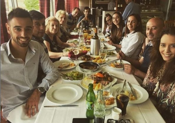 Bruno Fernandes was seated at a launch table with unidentified members of his immediate and extended family.
