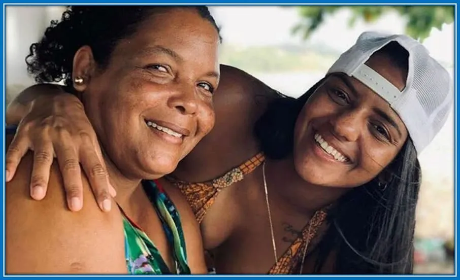 Geyse Ferreira's mother beside her footballer child.