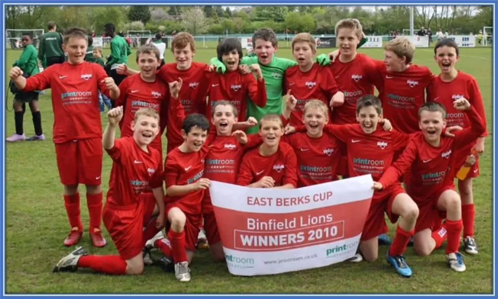 Connor Hall, who is at the front row (far left), is pictured celebrating with his Binfield under 12 teammates.