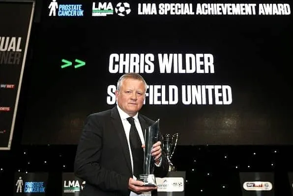 Chris Wilder holding on to his LMA Manager of the Year- 2018–19 award.