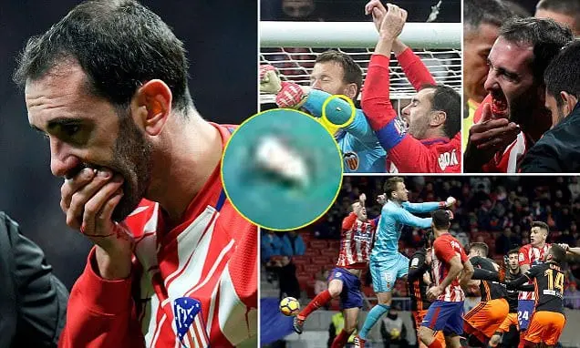 Can you notice Diego Godin's tooth flying?