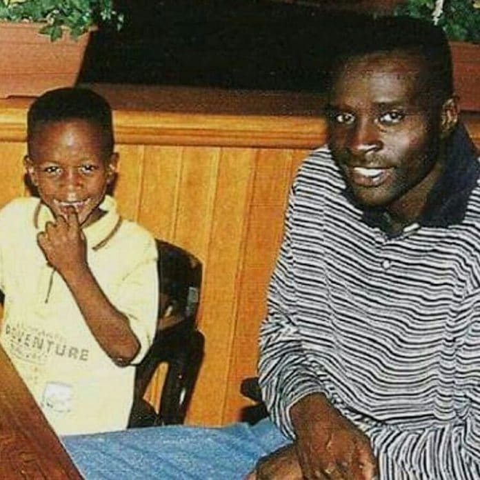 Young Divock with his father, Mike.