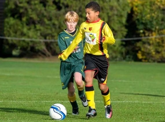 A young Jadon Sancho electrifies the pitch with his raw talent and boundless energy, leaving opponent behind in awe.