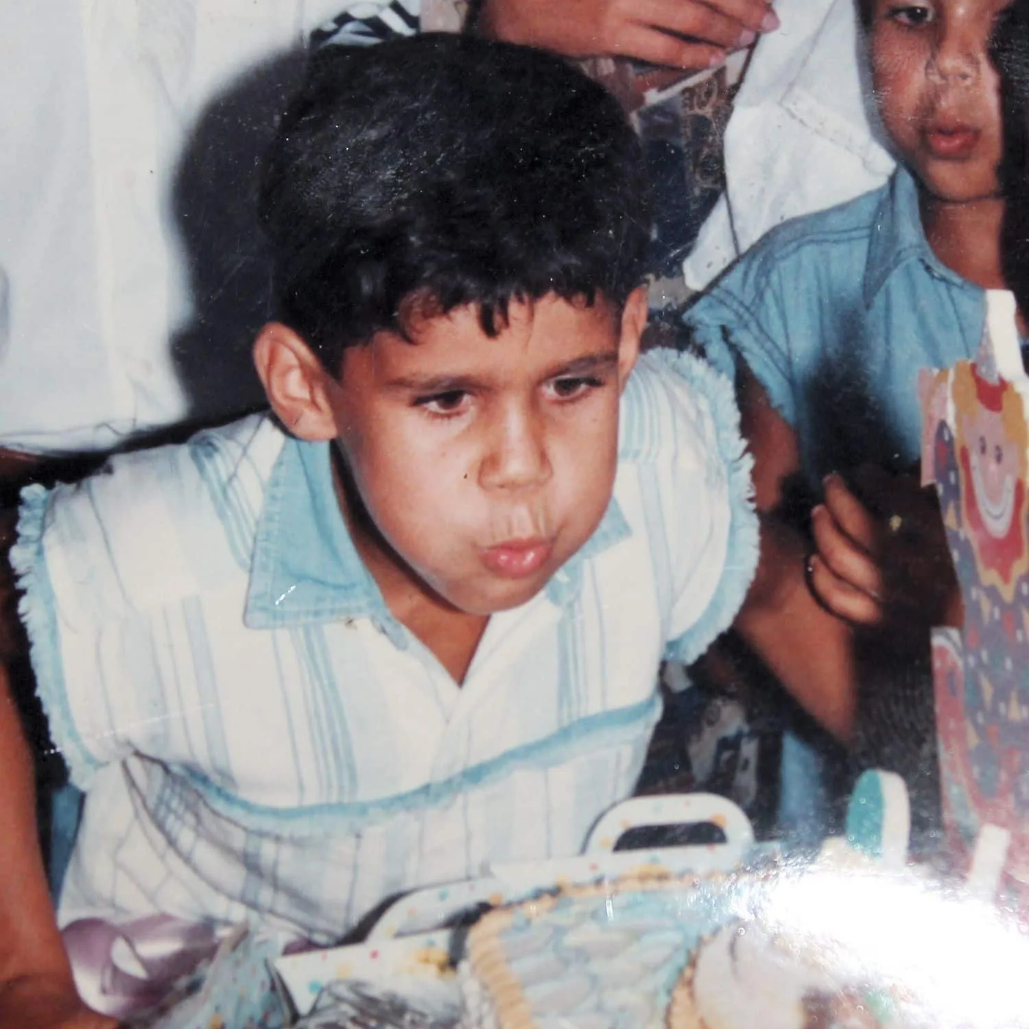 Diego Costa as a child blew off candles on his birthday.