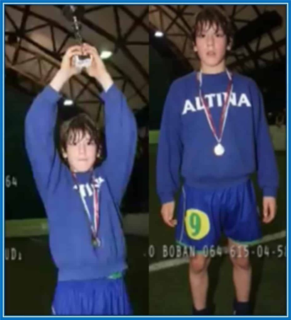 Amidst the sea of ecstatic faces, a young Dusan Vlahovic stands out, clutching his well-deserved trophy with a proud and determined gaze, fueled by his unwavering passion for the beautiful game.