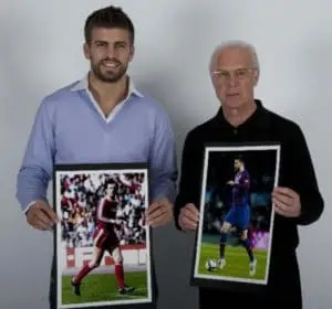 Legacy Meets Inspiration: Gerard Piqué, affectionately dubbed "Piquénbauer" for his Beckenbauer-esque style, shares a heartfelt moment with his idol, the legendary Franz Beckenbauer.