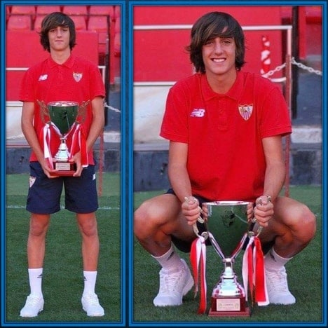 Gil holding one of his early Sevilla trophies.