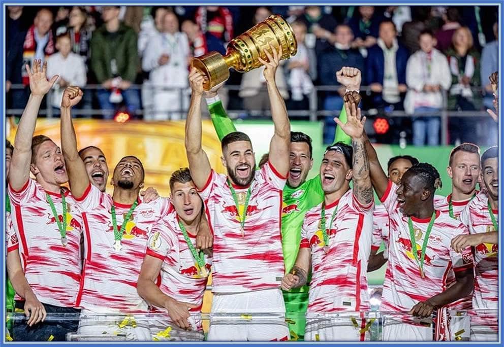 The 6 foot 1 Defender was at the centre of RB Leipzig's trophy celebration.