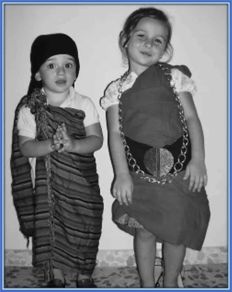 This is Gavi and his sister (Aurora) dressed in African attire, in what looks like a school drama.