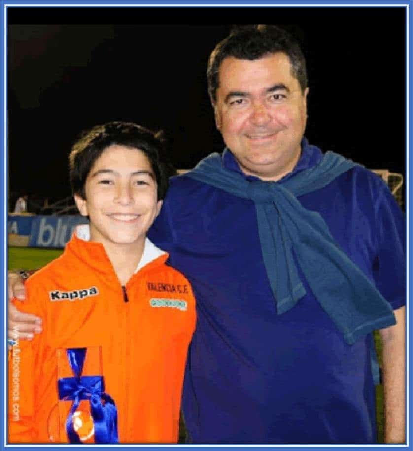 A childhood photo of Carlo's photo with his dad,