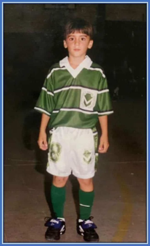 Young Nicolas Tagliafico, with his complete sports kit, poses for a photo as he is ready to play football.